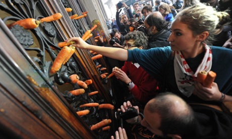 No waving sticks: Students throw carrots against the headquarters of the Ministry of Education in Turin, Italy.