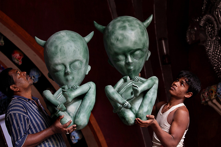 24 horus in pictures: Durga Puja festival preparations