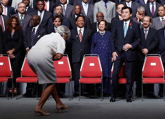 24 horus in pictures: Christine Lagarde curtsies to Japan's Finance Minister Koriki Jojima