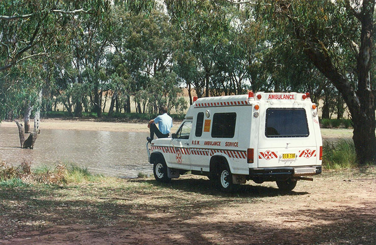 Benjamin Gilmour: A paramedic sits by a billabong