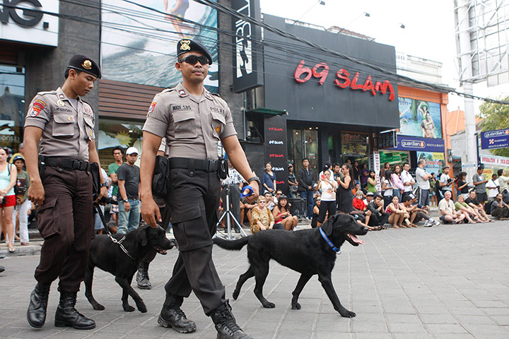 Bali anniversary: Indonesian police dog handlers patrol the 2002 Bali bombing memorial, Bali