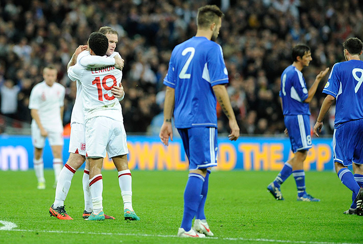 Tom England 3: Wayne Rooney celebrates his second goal of the game