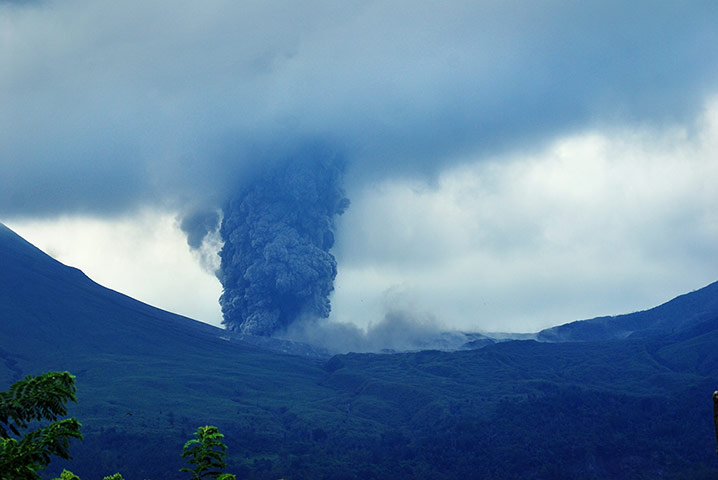 Twenty Photographs: Mount Lokon volcano spews volcanic ash on Sulawesi Island, Indonesia