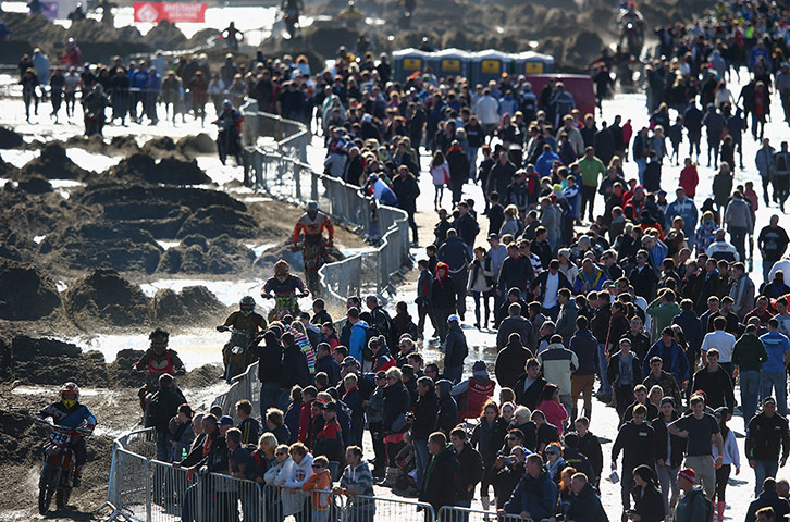 beach race: Competitors in action alongside the mass support 