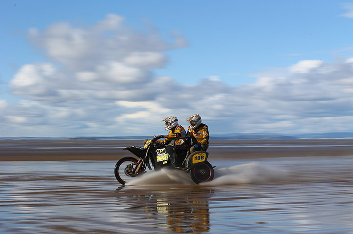 beach race: Competitors speed along the beach 