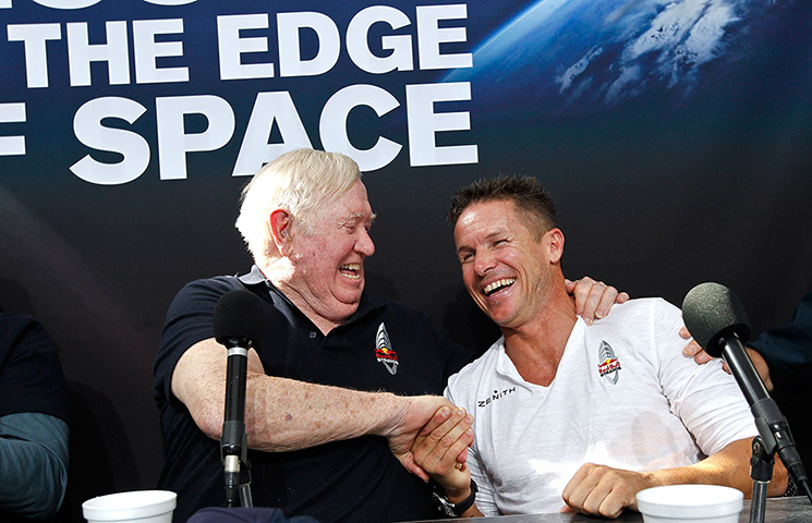 Skydive: Felix Baumgartner, right, shakes hands with Colonel Joe Kittinger