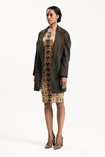 All Ages: Baroque: Model wears gold and black baroque patterned dress with black jacket