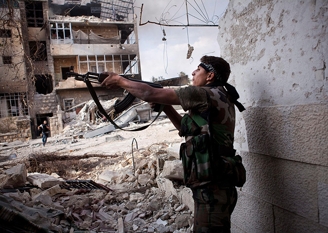 FTA: Maysun: A Free Syrian Army fighter shoots his weapon