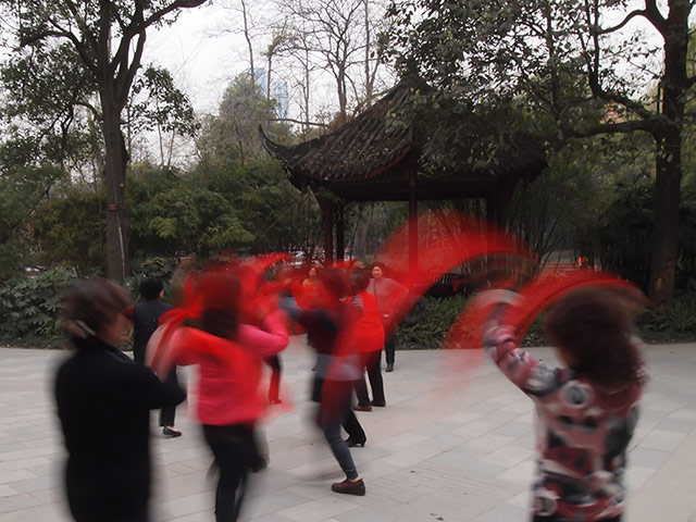 Your Picture: Rhythm: The motion of the red scarves, waved by dancing women in a park in Chengdu