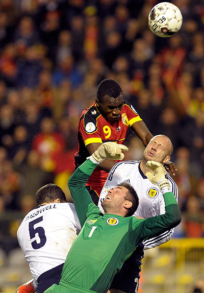 Tuesday WCQ: Belgium's Benteke tries to score past Scotland's goalkeeper McGregor