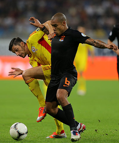 Tuesday WCQ: Ciprian Andrei Marica tussling with Nigel De Jong