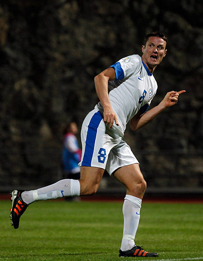 Tuesday WCQ: Estonia's Andres Oper celebrates a goal 