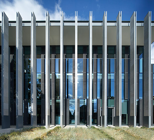 Stanton Williams projects: Dramatic metal lines in front of large glass facade of building