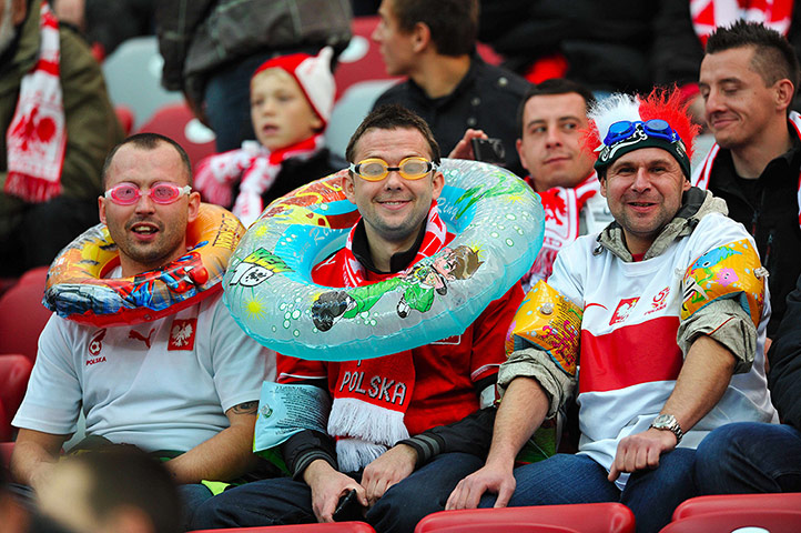 Poland v England: Polish fans wear aquatic equipment