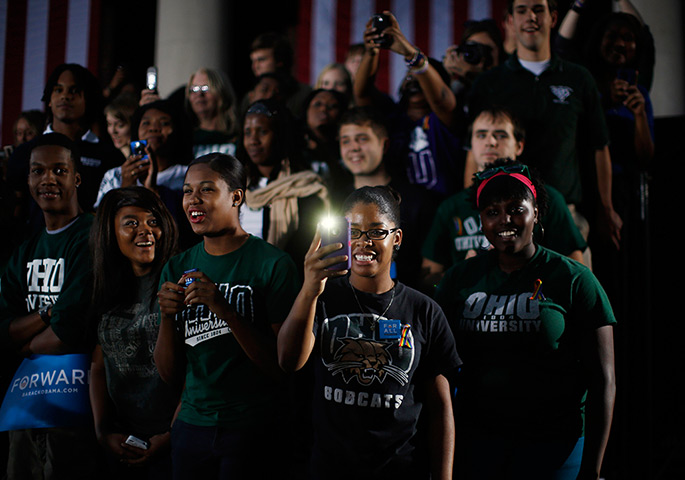 24 hours: Athens, Ohio, USA: A supporter takes a picture of President Barack Obama