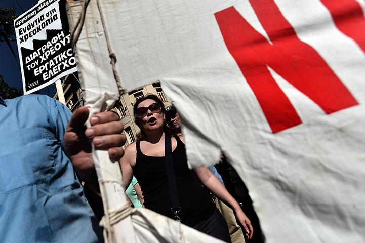 Greece protests: Demonstrators shout slogans during a 24 hour strike