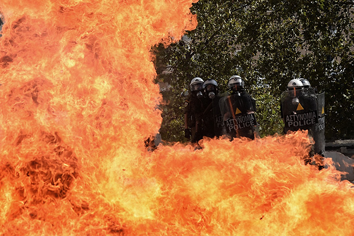 Greece protests: A firebomb explodes in front of the riot police