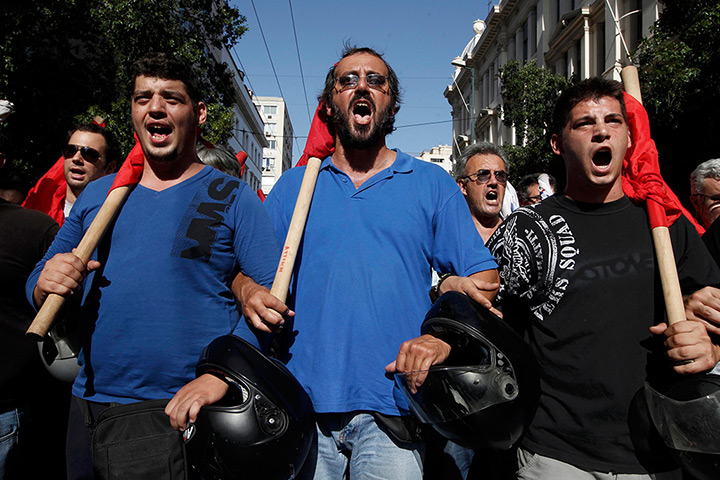 Greece protests: Members of Greece's Communist Party take part in a march
