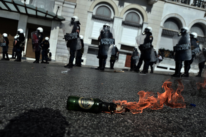 Greece protest update: A molotov cocktail burns in front of riot police