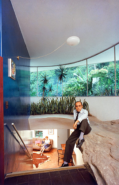 Oscar Niemeyer: Niemeyer sits on a rocky ledge at his self-designed home in Brazil