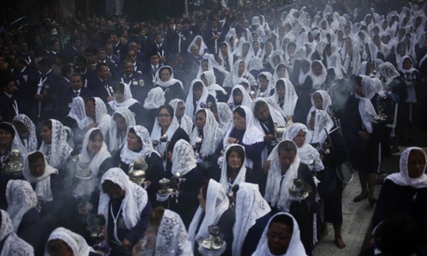 Women participate in a procession honoring "The Lord of Miracles," the patron saint of Lima, in Lima, Peru.