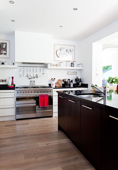 Kitchen with utensils and pans on display