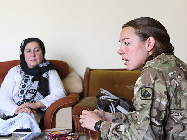 Female Soldiers: Jess, an independent states Gulalli, speaks to local residents