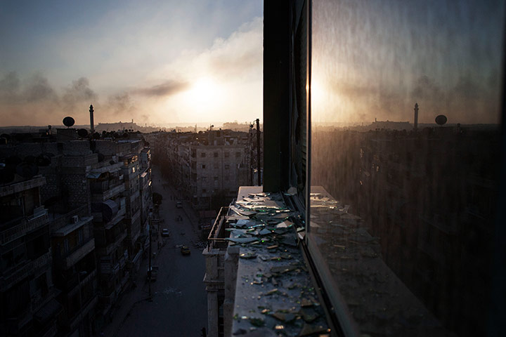 20 Photos: Smoke rises from a damaged building in Aleppo, Syria