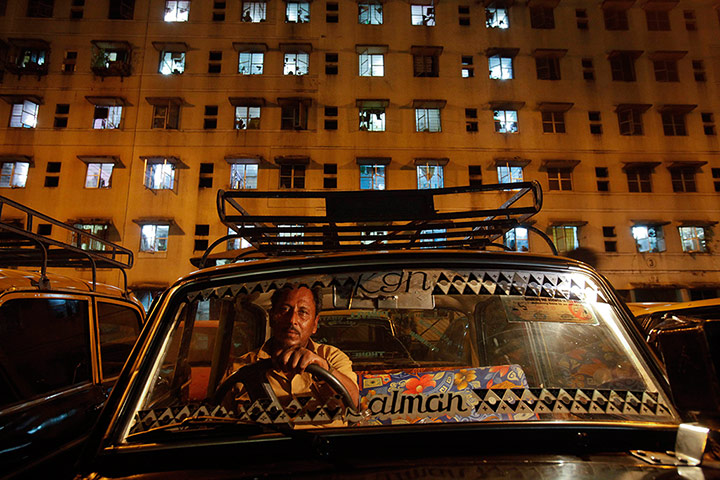 20 Photos: Driver waits in his Premier Padmini taxi in Mumbai's suburbs