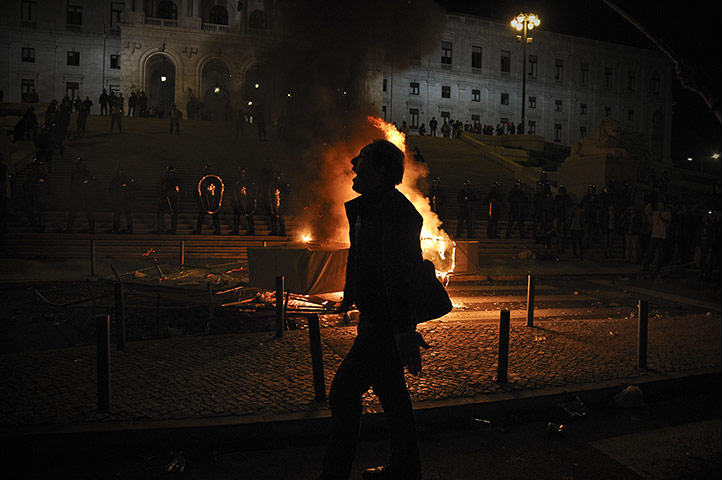 20 Photos: A demonstrator in a protest against the Portuguese government's 2013 budget