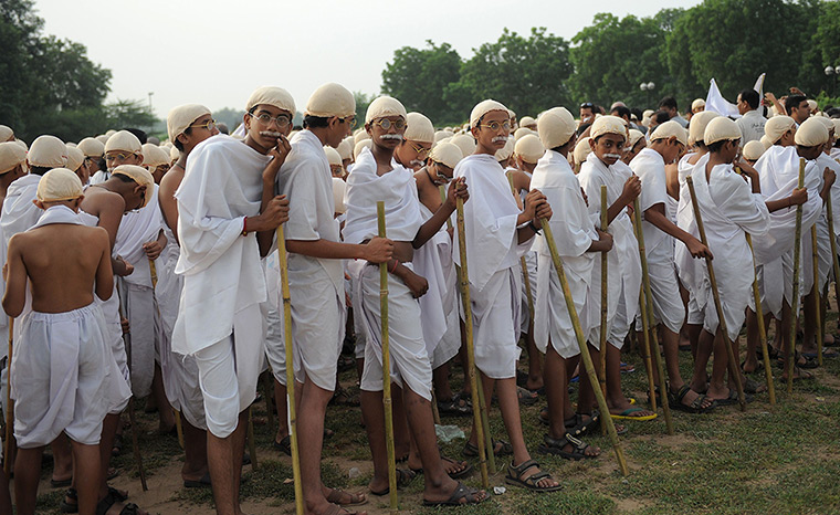 24 hours in pictures: Indian students dressed in the attire of Mahatma Gandhi