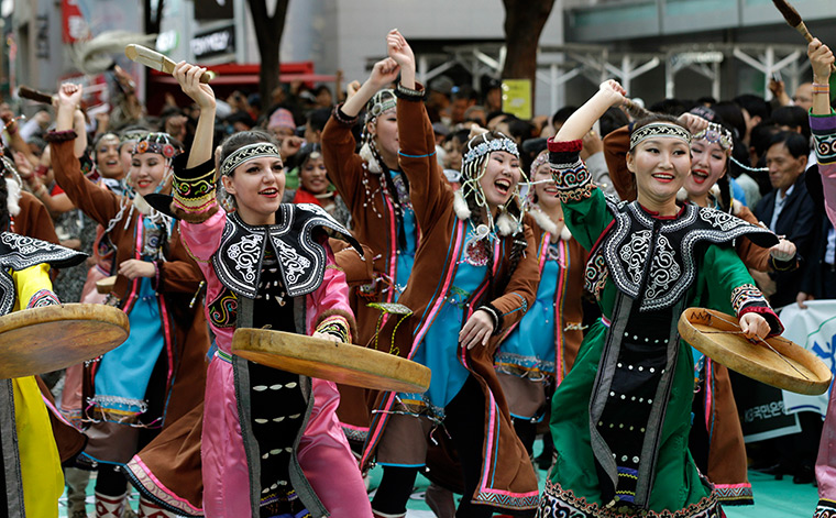 Gangnam style parade: Participants from Russia dance