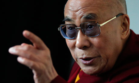 Tibet's exiled spiritual leader the Dalai Lama answers questions at a news conference in Manchester