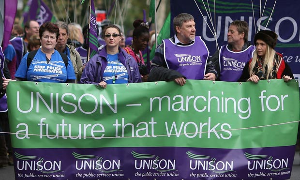 Unison trade union members take part in a TUC march to protest against government cuts in London