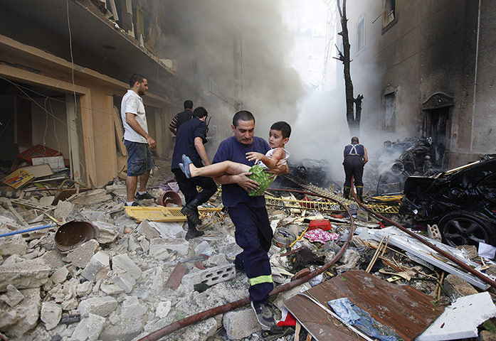 24 Hours: An injured boy is taken away from the scene of an explosion in Beirut