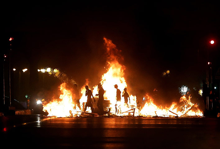 24 Hours: Lebanese men block a road in Beirut