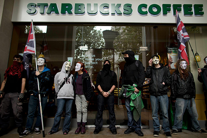 20 Photos: Demonstrators before the start of an anti-austerity protest march in London