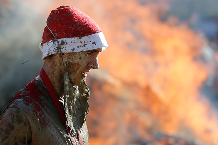 24 hours in pictures: A participant reacts after the Wild Boar Dirt Run