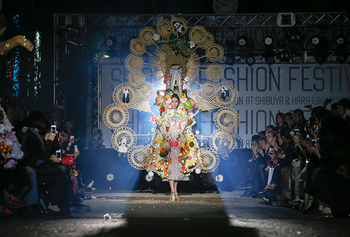 24 hours in pictures: A model presents a creation by Yoshikazu Yamagata