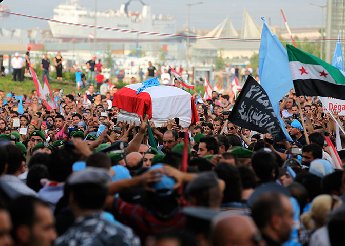Beirut funeral: Security Forces carry the coffin of Wissam al-Hassan