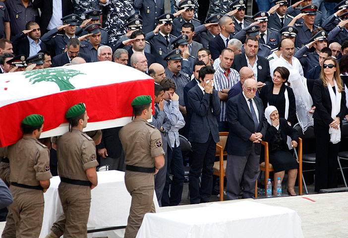 Beirut funeral: Wissam al-Hassan's coffin is brought in front of his mourning family