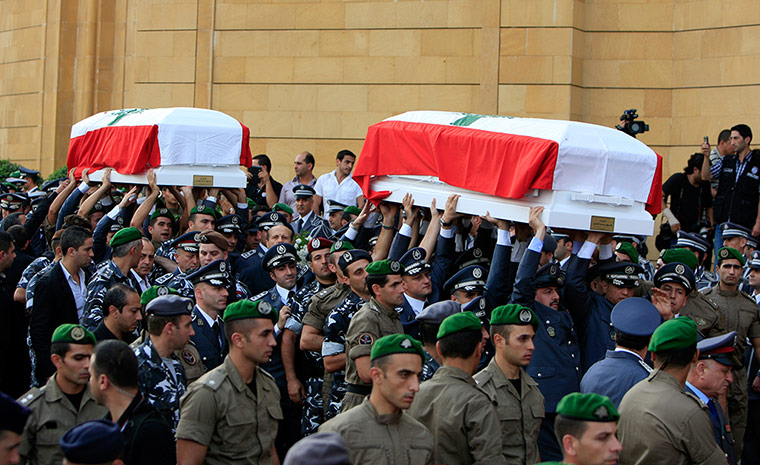 Beirut funeral: The two coffins are carried in a funeral procession to Martyrs' Square
