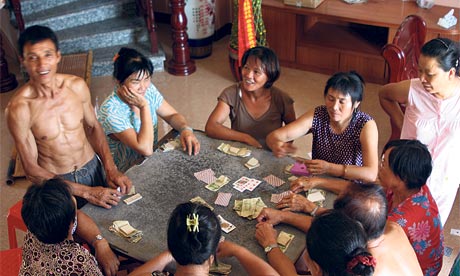 wives of migrant workers play cards