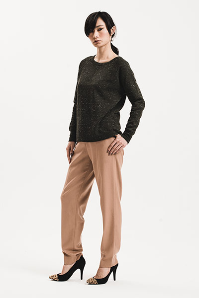 All Ages: Military: Model wears black jumper and camel trousers