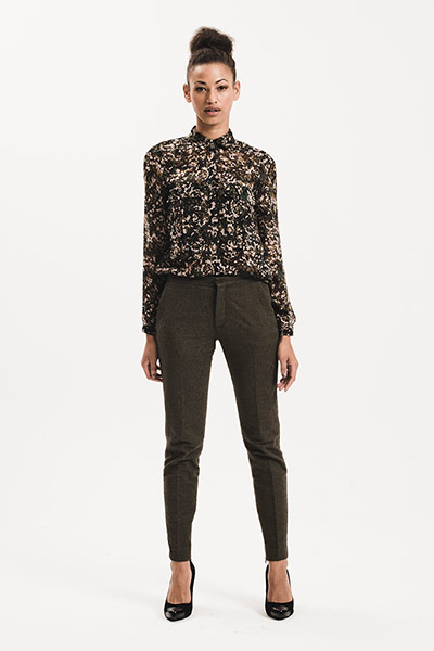 All Ages: Military: Model wears camouflage patterned blouse and dark trousers