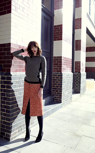 Fashion: Jumpers: Model wears Black and white jumper with tweed skirt