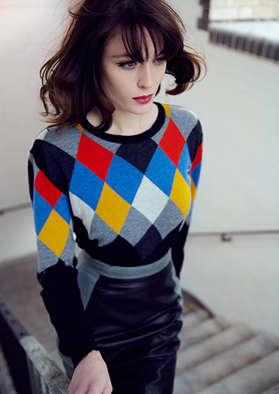 Fashion: Jumpers: Model wears Diamond print jumper and leather skirt