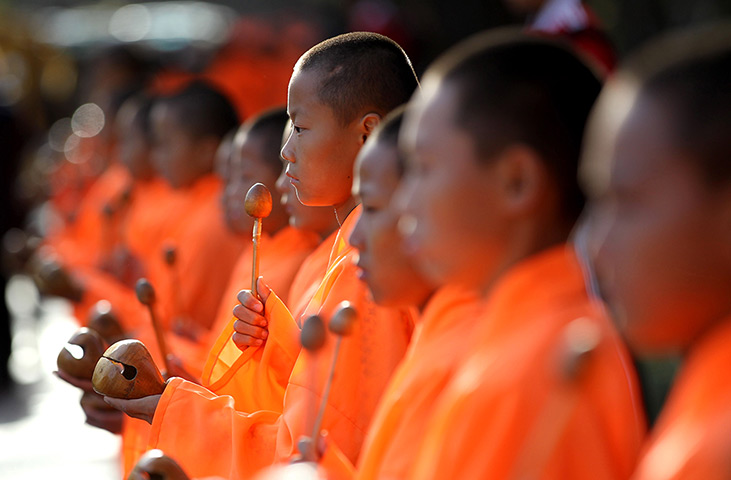 Kung Fu festival : Students from a martial arts school hold wooden fish during the ceremony