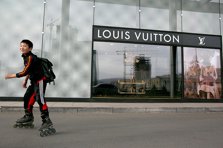 FTA: Paula Bronstein: A young boy rollerblades by the Louis Vuitton shop in Ulan Bator