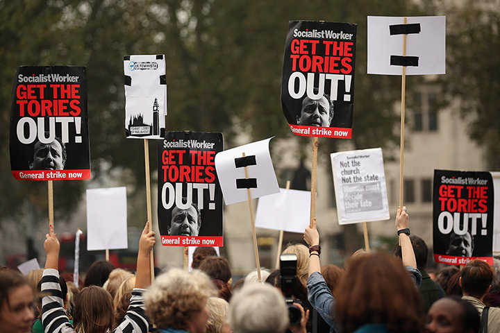 Sufragette march: Campaigners hold up anti-government placards 